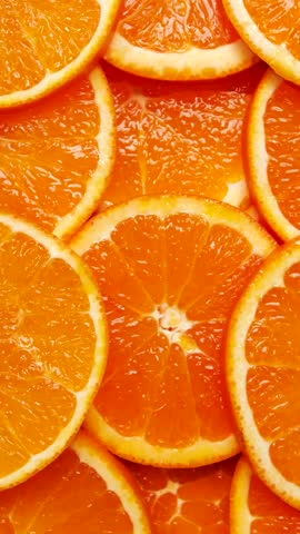 Fresh orange slices beautifully arranged for a vibrant summer snack or dessert decoration