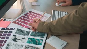 This image captures a vibrant design workspace featuring color swatches, graphic design tools, and a digital monitor, perfect for inspiring creative projects and organization. SACTR - Powered by Shutterstock - Get 15% off with code: PIKWIZARD15