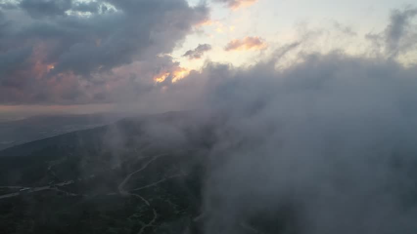 Mount Carmel, located in the city of Haifa, at a misty sunrise from a drone view