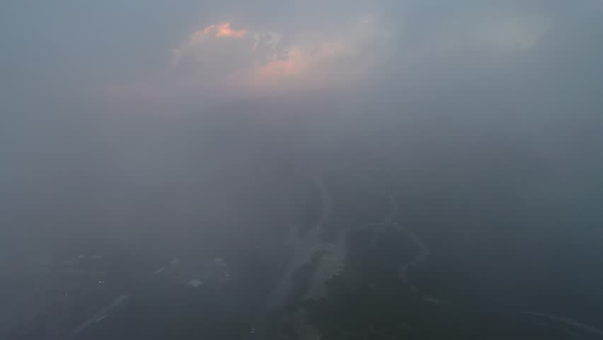 Mount Carmel, located in the city of Haifa, at a misty sunrise from a drone view
