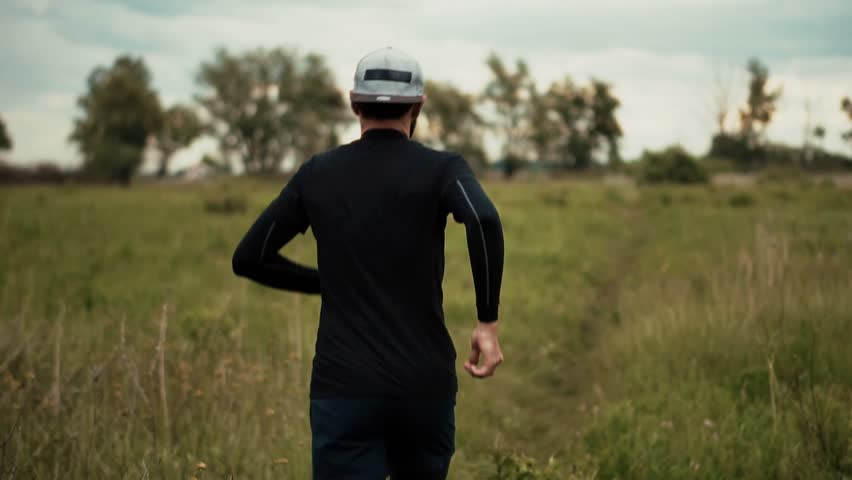 Male Runner Jogging Athlete In Motion. Trail Running Adventure Fitness Training. Endurance Sport. Cardio Workout. Run Recreational Sport. Runner Physical Wellness Routine. Personal Goal Running Jog