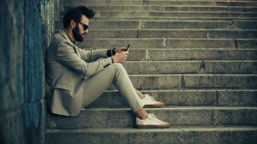 Businessman In Suit Using Smartphone. Urban Business And Modern Lifestyle, Digital Connectivity, Technology Integration Urban Commuting. Professional Using Mobile Phone Outdoors. Digital Communication - Powered by Shutterstock - Get 15% off with code: PIKWIZARD15