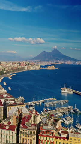 View of the Gulf of Naples with Mount Vesuvius far in the background at sunny day. Naples, Italy