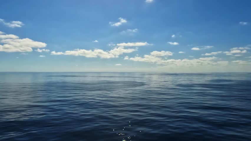 White clouds in blue sky and ocean with calm waters. Sailboat traveling in open sea during vacation. Cruise ship sailing