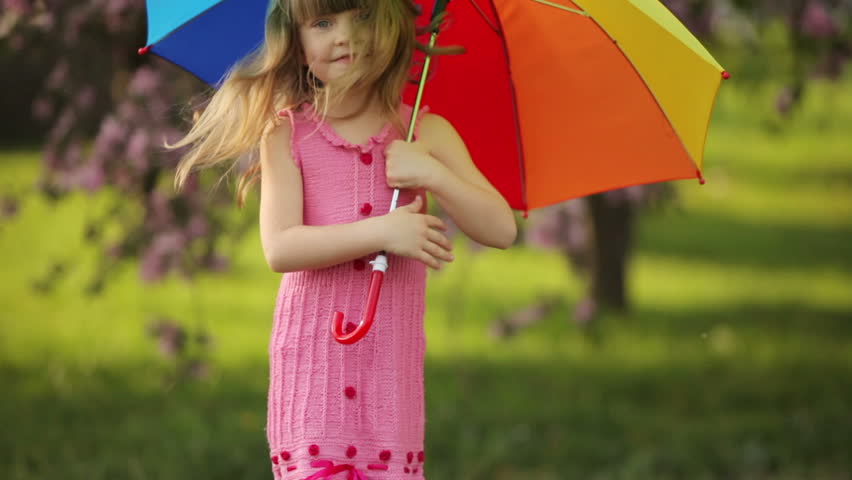 Sweet girl jumping with umbrella
