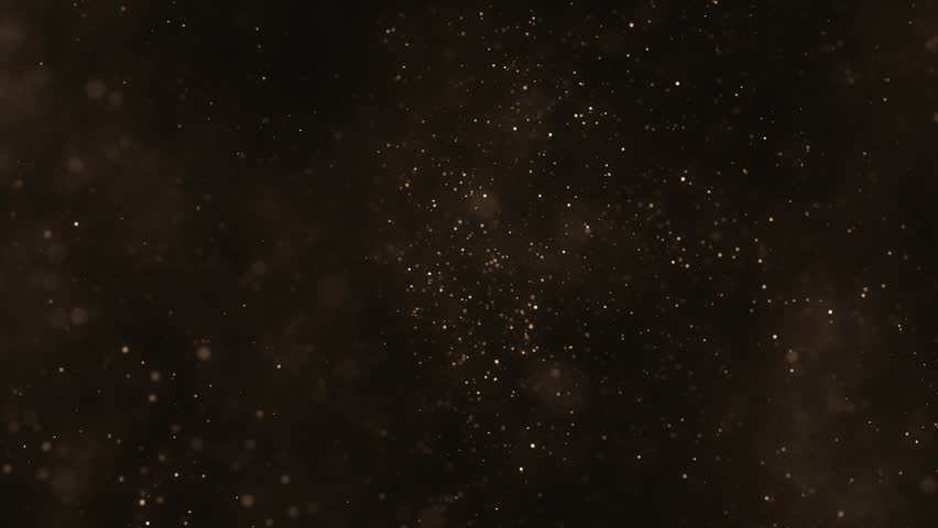 Luxury background with glittering shiny gold particles and shimmering bokeh light. Elegant golden background ideal for glamorous events, award ceremonies or talent shows. 