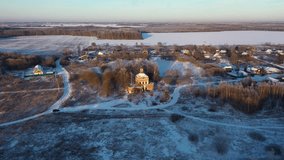 Ruined brick church on the edge of a village in winter at sunset, top view - Powered by Shutterstock - Get 15% off with code: PIKWIZARD15