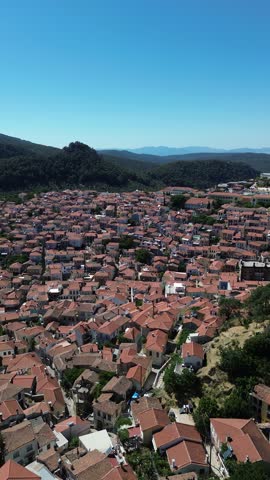 Agiasos, Island Lesvos, Greece - July 14th, 2025 - footage of the mountain town, traditional architecture, streets, roofs, temples, green forest, slopes and panoramic views