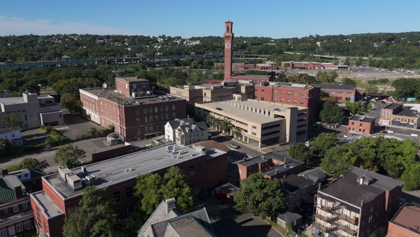 view of Waterbury Connecticut flying back past church steeple
