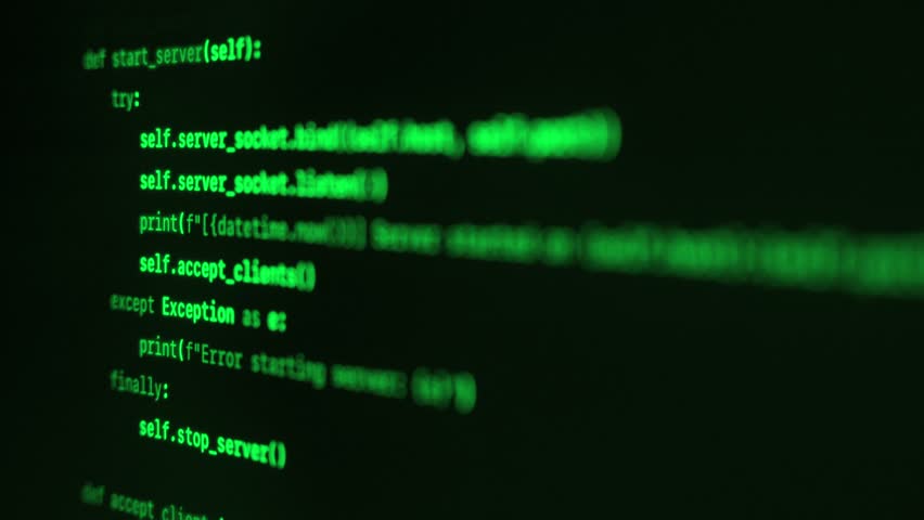 Close up of green programming code on a dark screen. Cybersecurity or hacking concept