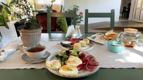 Cozy morning breakfast in a sunlit cafe with eggs syrniki tea toast salad salami and strawberries - Powered by Shutterstock - Get 15% off with code: PIKWIZARD15