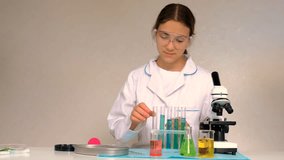 Laboratory research test tubes reagents and microscope. Selective focus. - Powered by Shutterstock - Get 15% off with code: PIKWIZARD15