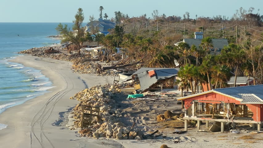 Destroyed houses on ocean shore after hurricane Milton landfall. Natural disaster consequences on Manasota Key, Florida. Storm surge severe damage.