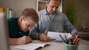 Caring father guiding son through homework, offering patient support and helping him understand challenging academic tasks - Powered by Shutterstock - Get 15% off with code: PIKWIZARD15