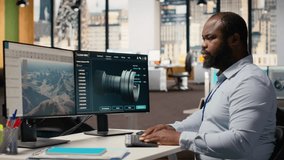 Technician using CAD software to optimize wind turbine blade aerodynamics, reducing carbon footprint. African american man in office testing advanced materials of eco friendly windmill, camera B - Powered by Shutterstock - Get 15% off with code: PIKWIZARD15