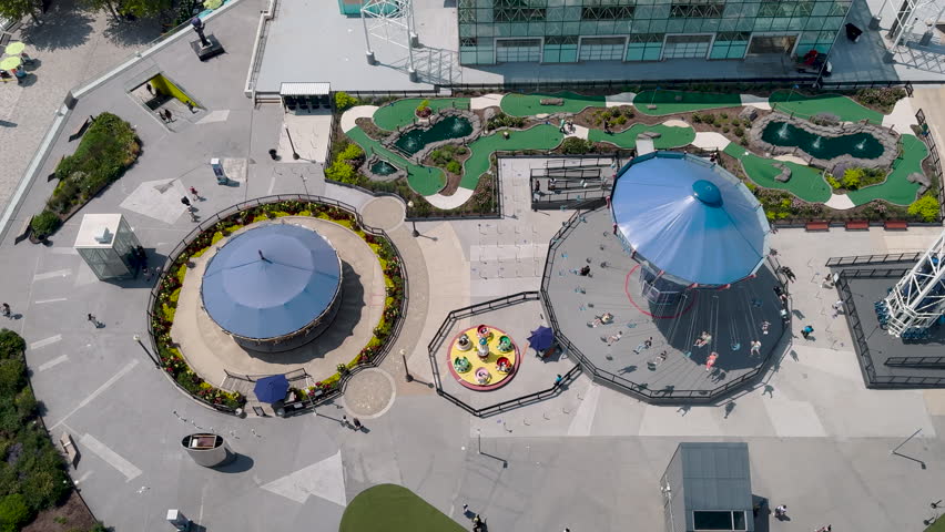 Aerial view of a merry go round carousel in motion. Summer scene at Navy Pier in Chicago, Illinois, USA.