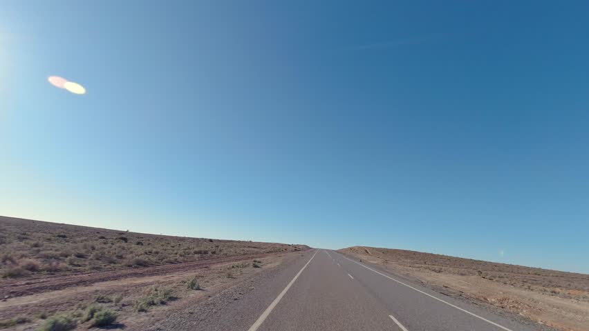 Driving through the arid landscapes along the Silver City Highway near Fowlers Gap I outback New South Wales
