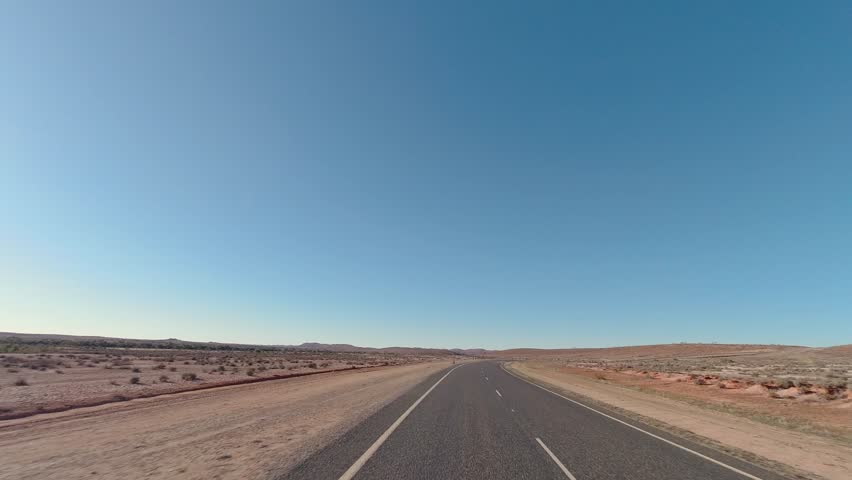 Driving through the arid landscapes along the Silver City Highway near Fowlers Gap I outback New South Wales