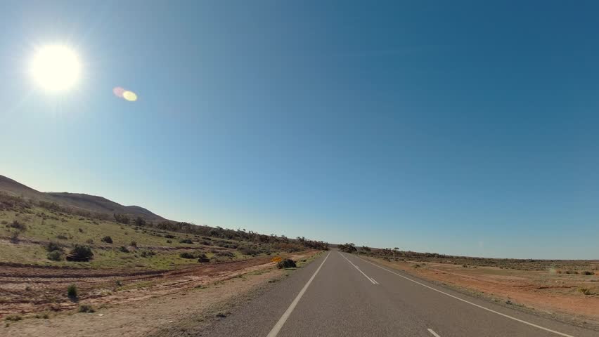 Driving through the arid landscapes along the Silver City Highway near Fowlers Gap I outback New South Wales
