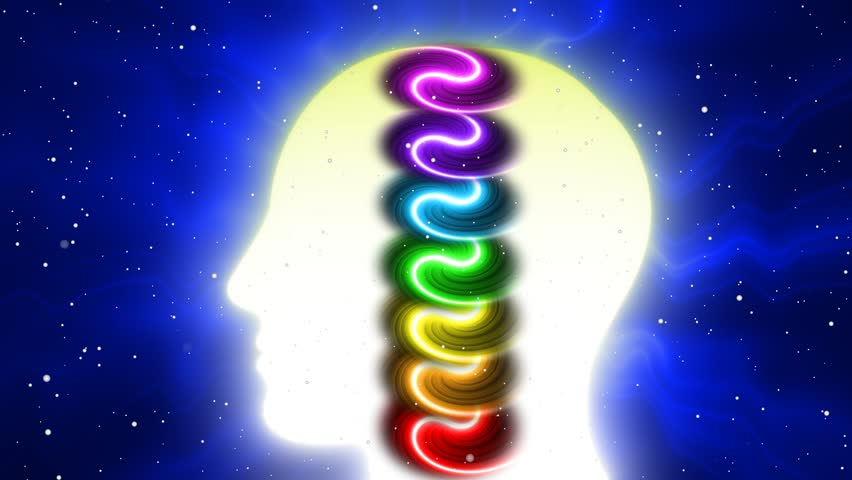 Human head silhouette with chakra light effect