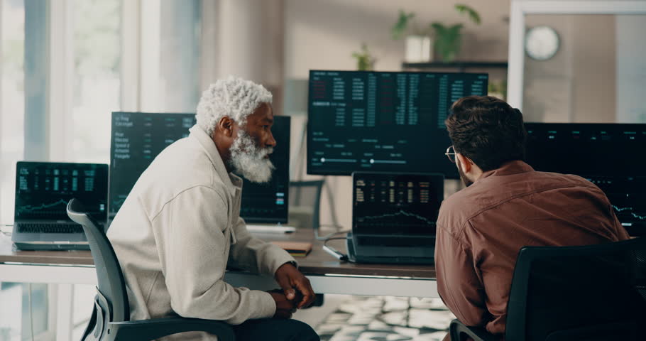 Businessmen, stock market and trading with computer in office for company finance or investment. Back view, male people or broker with technology, screen or cryptocurrency for exchange in workplace