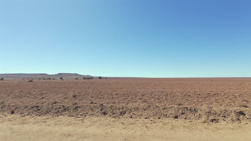 Drivers window view of the landscape along Cameron Corner Road west of Tibooburra in outback New South Wales