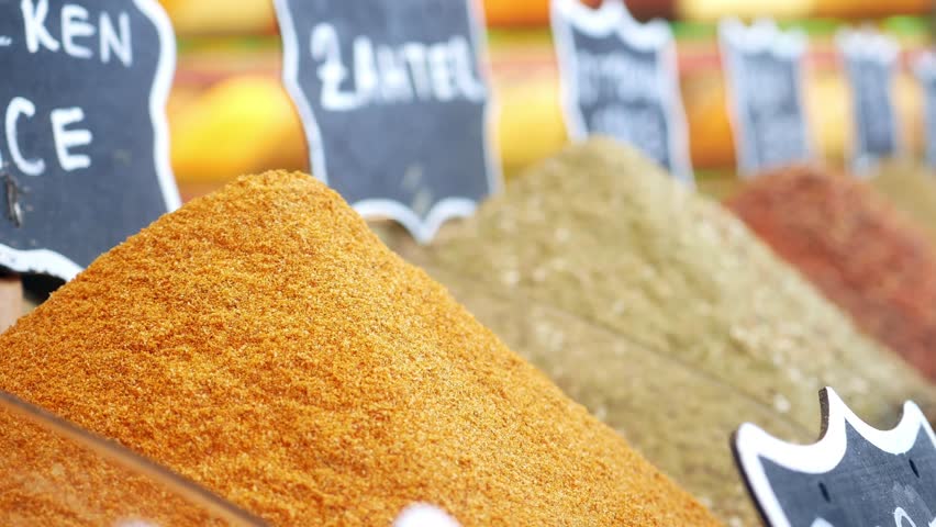 Colorful spices displayed at local market in vibrant setting