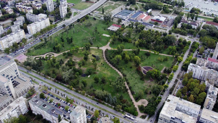 Exploring a large urban park in the heart of the city with greenery and recreational areas