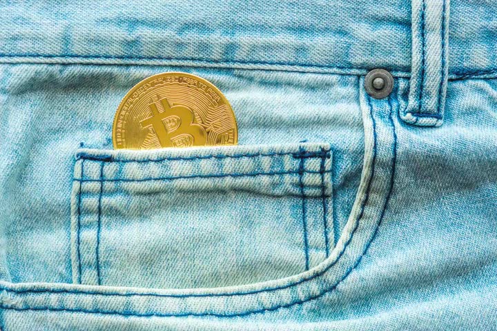 Video of a golden Bitcoin in a jeans coin pocket