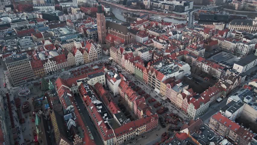 Aerial view of Wroclaw Market Square in Poland. European city with historic colorful buildings, the Old Town Hall and Christmas market stalls in winter