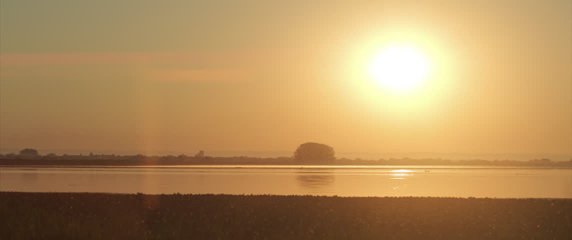Hot summer sun over the Danube river bay 4K scope footage