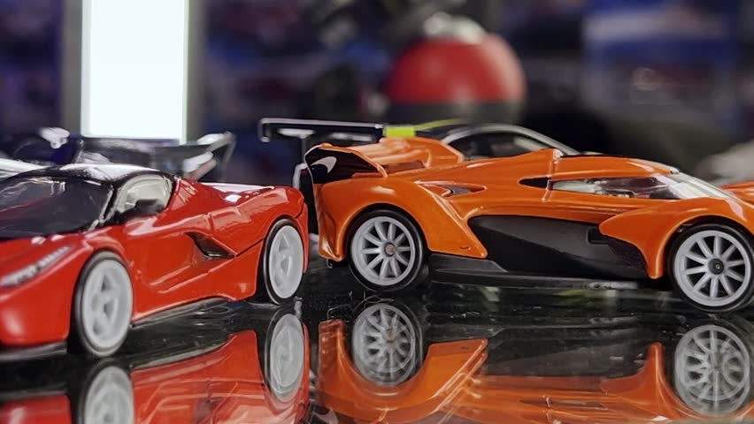 Close up of multiple toy cars spinning in circles inside a toy shop in Cuernavaca, Mexico.