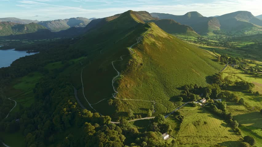 Drone footage flying towards the Cat Bells ridge hiking trail in the Lake District, UK during golden hour