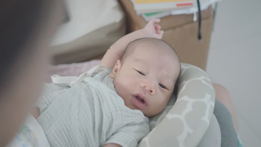 A serene image of a cherubic baby relaxing in a cozy crib, displaying innocence and tranquility. Soft colors and gentle lighting create a warm atmosphere, capturing the essence of early childhood mome