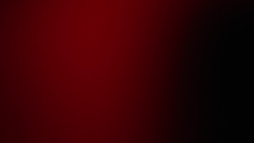 Smooth gradient of deep red transitioning to black, creating a dramatic and bold visual effect. Abstract gradient animation background