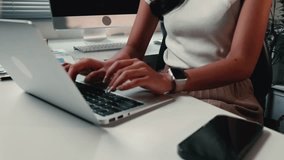 Professional businesswoman typing rapidly on laptop, demonstrating high-efficiency work performance in bright, modern office workspace - Powered by Shutterstock - Get 15% off with code: PIKWIZARD15