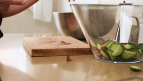 Close-Up of Hands Chopping Vegetables in a Kitchen Setting - Powered by Shutterstock - Get 15% off with code: PIKWIZARD15