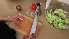 Person Preparing Fresh Vegetable Salad in Modern Kitchen Setting - Powered by Shutterstock - Get 15% off with code: PIKWIZARD15