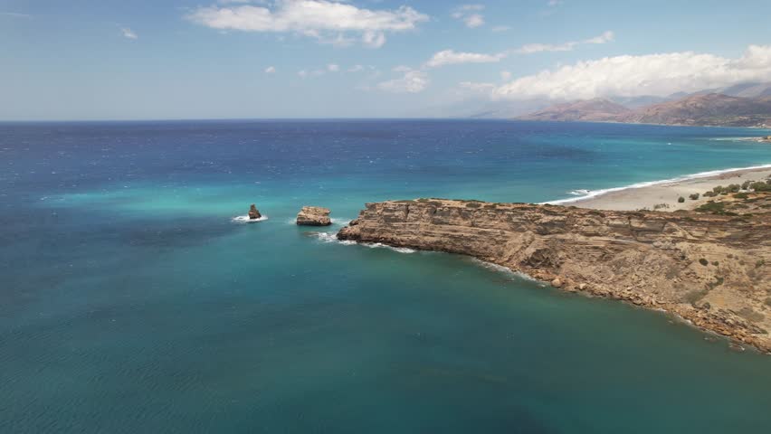 Aerial footage of Triopetra seaside bluff and its rugged coastline, located in the south of Crete, Greece