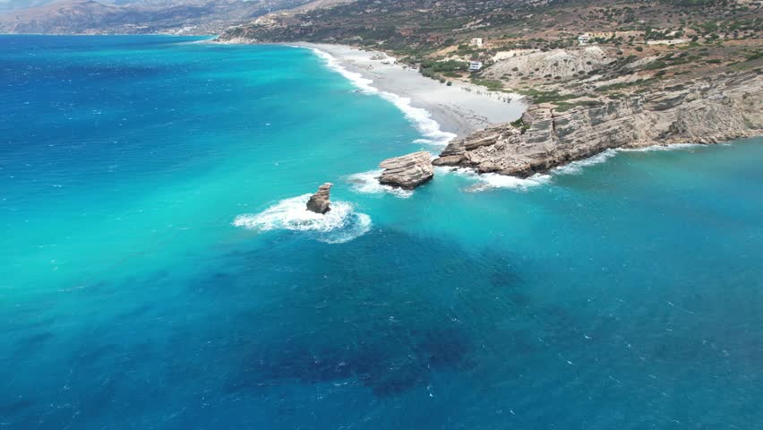 Aerial footage of Triopetra seaside bluff and its rugged coastline, located in the south of Crete, Greece