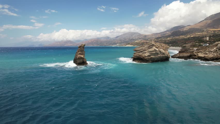 Aerial footage of Triopetra seaside bluff and its rugged coastline, located in the south of Crete, Greece
