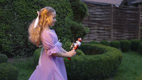 Girl with bow holding wooden toy nutcracker soldier - Powered by Shutterstock - Get 15% off with code: PIKWIZARD15