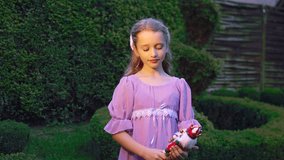 Child holding wooden nutcracker doll with tenderness - Powered by Shutterstock - Get 15% off with code: PIKWIZARD15