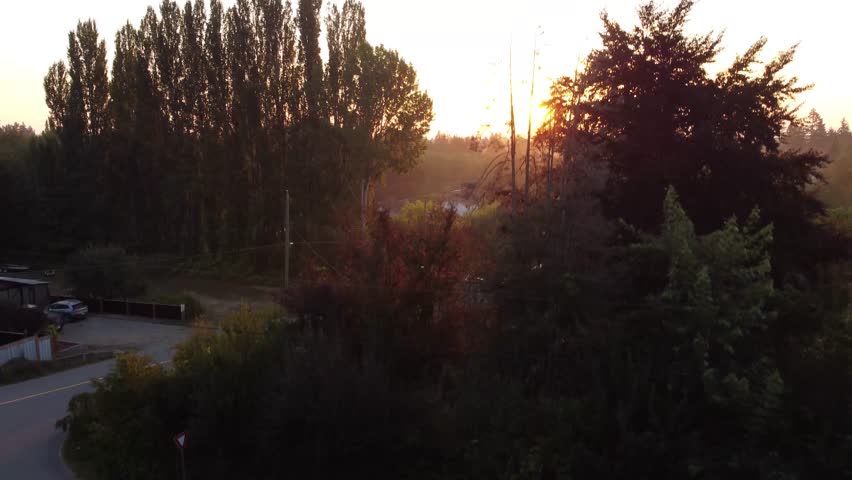 Drone footage, sunrise over back road