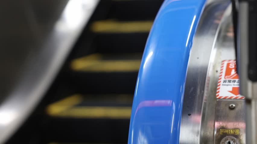 An escalator moving in a downward direction.