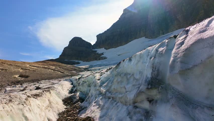 A close-up scenic view of Grinnell Glacier overlooking Upper Grinnell Lake in Glacier National Park