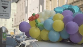 Colorful balloons on car, festive vehicle decoration with balloons, celebration car with air balloons, party decoration on automobile, wedding car with balloons - Powered by Shutterstock - Get 15% off with code: PIKWIZARD15