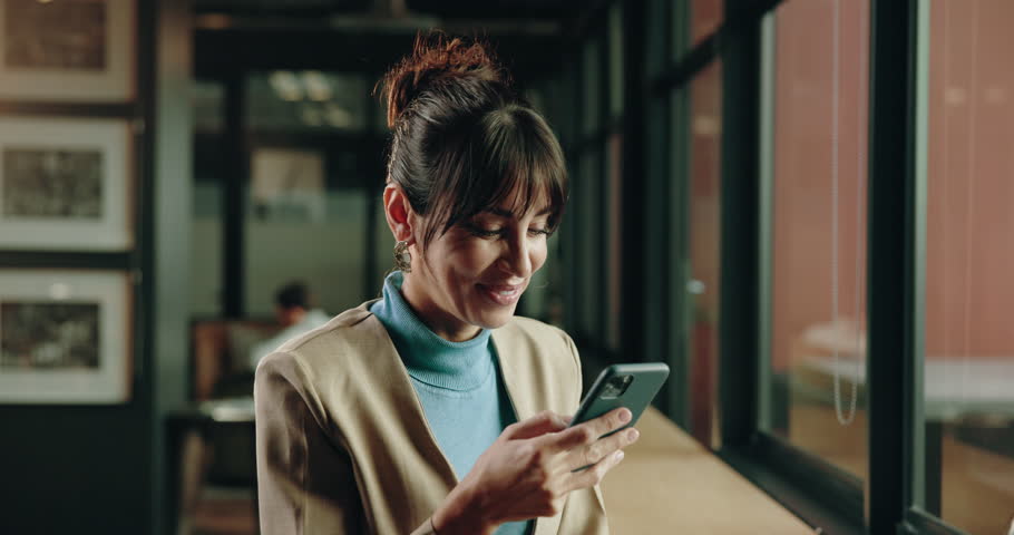 Woman, phone and happy with notification at art gallery for deal, contact or sale for record price. Person, curator or dealer with smartphone, excited or good news for exhibition funding at workplace
