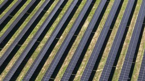Solar Panels Arrays, Aerial View of Solar Power Station on Sunny Day, Close Up Drone Shot - Powered by Shutterstock - Get 15% off with code: PIKWIZARD15