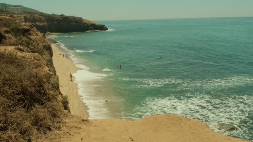 Sunset cliffs natural park beach in ocean beach san diego crowded during summer time, beach goers and people swimming
